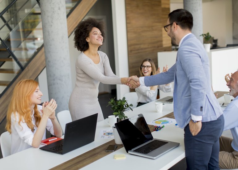 businessman-shaking-hands-seal-deal-with-his-female-partner